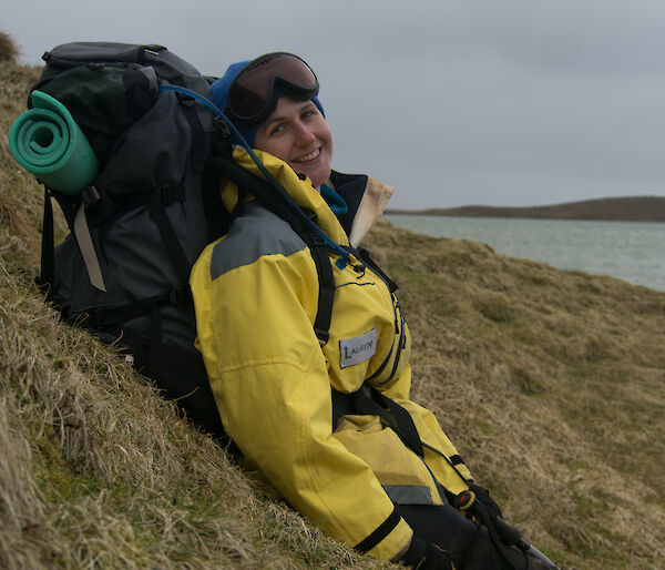 Lauren leaning against a hill