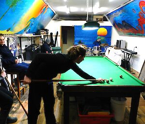 In the post office, expeditioners play a game of pool and band practice