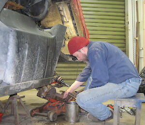 Robby replacing suspension brushes on a vehicle