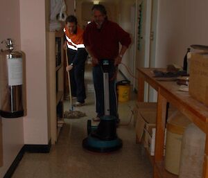 Tom and Jim cleaning the science building with mop and floor polisher