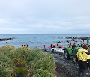 Busy time on the beach during cargo unloading at Macca