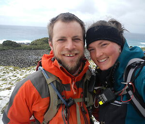 Kelly and Cameron pose for the camera, smiling