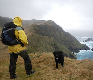 Dave and Wags (dog) on a cliff overlooking the water