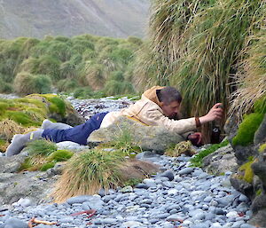 Charles taking water samples for hydrocarbon analysis