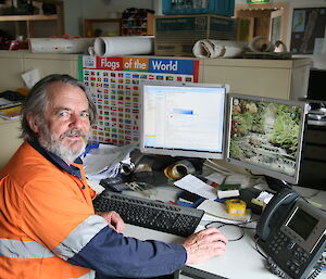 Jim (Building Services Supervisor and Deputy SL) completing a course online