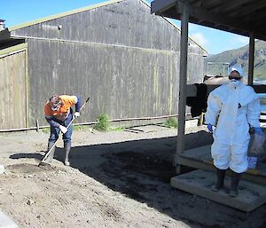 Clean-up team -- two expeditioners clean up the station outside