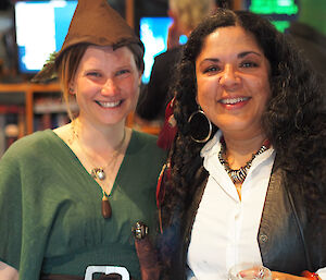 Karen and Mel pose in costumes for a station party