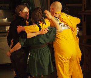 A group of expeditioners huddle on the dance floor