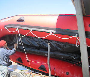 Robby stripping and washing the IRB (inflatable boat)