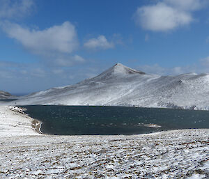 Gratitude Lake surrounded by snowy peaks