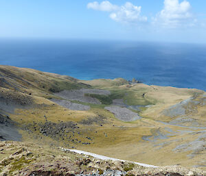 View from the plateau looking down a small valley to the sea