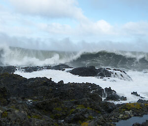Very large waves crash against Macquarie Island’s rocky shore