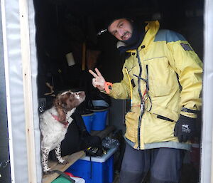 Steve and Katie (dog) pose in Tiobunga hut