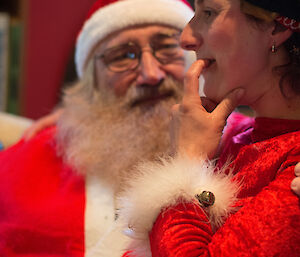 Dana telling Santa what she wants — a close up of Dana on Santa’s knee