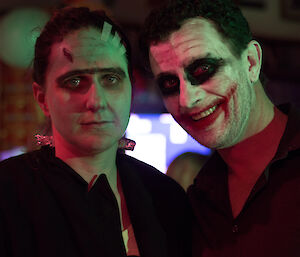 Richard Dakin dressed as the Joker from The Dark Knight and a female expeditioner is dressed as Frankenstein