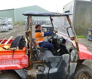 Expeditioner driving the small red station ute