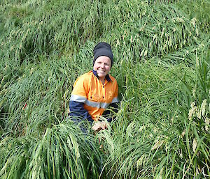 Female expeditioner in amongst the tussocks