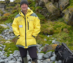 Full photo of expeditioner dressed in yellow water proof clothing