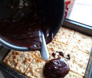 Dessert — chocolate poured over a biscuit base