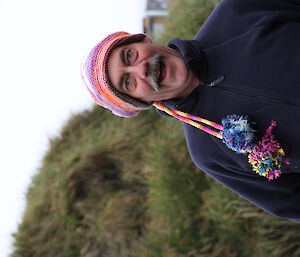 Head and shoulder photo of an expeditioner wearing an odd home made beanie