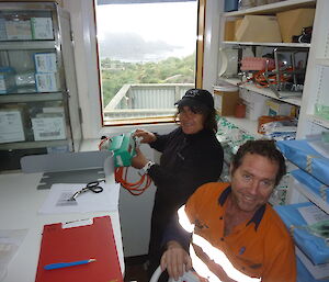Two expeditioners learning how to use medical equipment