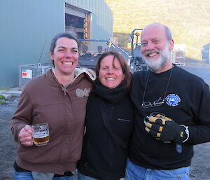 Close up of three expeditioners posing for the camera