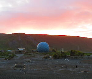 Sun setting over the satellite dome