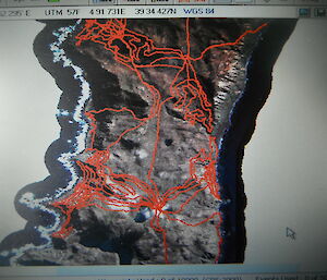 Map of the island terrain with red lines covering areas where expeditioner has walked