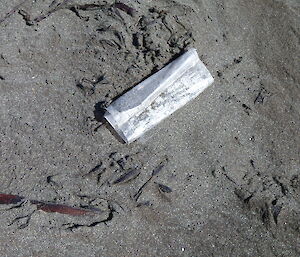 Small white plastic bag on the sand