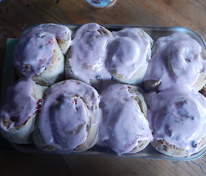 Close up of bread scrolls, light purple icing on top