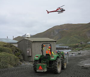 Tractor driving towards cargo on isthmus