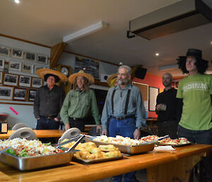 Several of the winter crew, most dressed in Mexican theme, listening intently as Patty describes the food and its role in Chilean culture