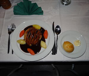 Beef wellington with gravy carrits and potatoes served by Tony