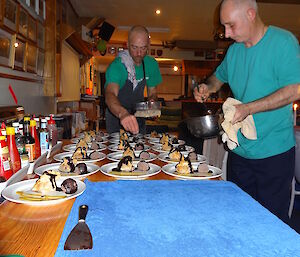 Tony and Marty getting dessert ready all desserts are laid out on table