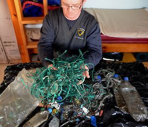Picking up the rubbish from the beach as just part of the job – sorting takes a lot longer. Chris is seen here sorting all the rubbish. The ball of green twine in his hands comprised 272 separate pieces, lengths varied from 3cm to 1.2m. There was 69.2 metres in all
