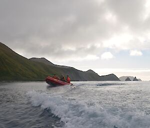 One of the IRB’s with expeditioners and equipment, heading south along the rugged, steep sloped East coast. The Nuggets, rock stacks, in the back ground and North Head (station) in the distance