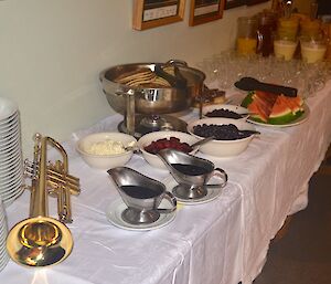 Breakfast food on a table with a trumpet