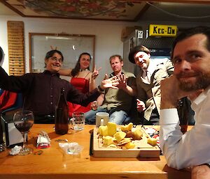 Barry, Leona, Mike, Craig and dean sitting at the bar with a cheese platter infront