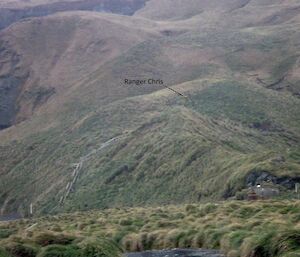 Steep slope up to the plateau showing Razorback steps and lookout, Doctors track behind and Chris at work up the top