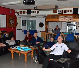 View of several expeditioners watching the FA Cup final projected onto a big screen in the mess