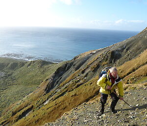 MIPEP hunter Nick McCabe leaning on his trusty walking pole above the razor back hill on Macquarie Island.
