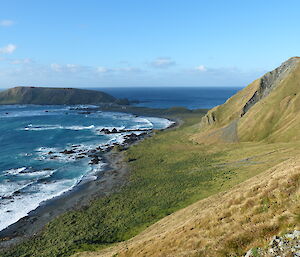 The headland for North Head and the station are visible in the background with the isthmus and the ocean washing onto west beach to the left of shot. Perseverance Bluff looking like a gravel fish on the tussock hillside to the right.