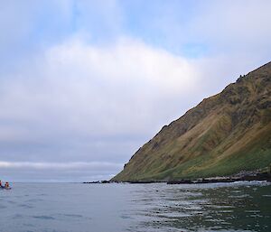 View from one of the boats looking south with the rugged coast near Mt Jeffryes on the right and one of the other boats in the left of picture