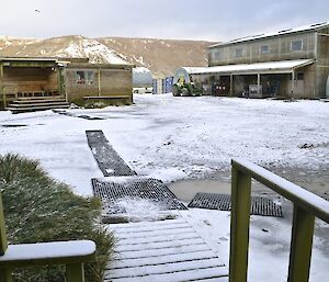 View from Hasselborough House porch last Sunday morning, showing the ground, building roofs and distant hills covered in layer of snow