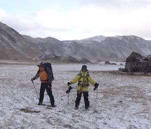 Patty and Marty wearing their snow gear standing on the feather bed