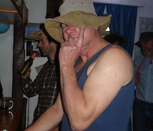 Dave folding his cowboy hat down
