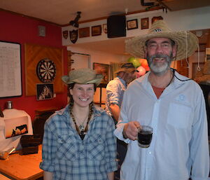 Karen and Craig dressed as outback characters wearing their cowboy shirts and hats