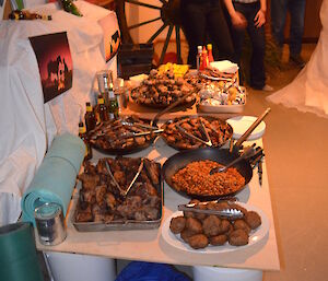 Grilled meats, Chilli bean plate, corn all set out on the tables to feast on