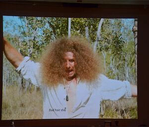 A image of Billy with his ‘frizzy’ hair shown on the big screen in the mess