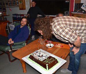 Billy blowing out the candles on his birthday cake